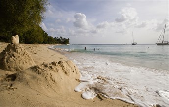 WEST INDIES, Barbados, St Peter, Gibbes Bay beach in the late afternoon with sandcastles at the
