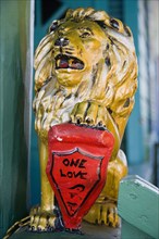 WEST INDIES, Barbados, St James, Golden lion decoration at the One Love Bar in Holetown