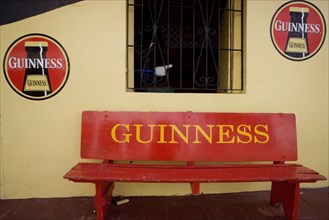 WEST INDIES, Barbados, St Peter, Guiness signs outside the Fishermans Pub in Speightstown