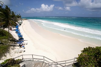 WEST INDIES, Barbados, St Philip, Crane Beach with sunbeds and umbrellas on the beach edge