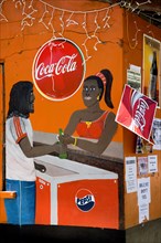 WEST INDIES, St Vincent & The Grenadines, Bequia, Wall painting on a bar depicting woman selling
