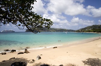 WEST INDIES, St Vincent & The Grenadines, Bequia, Lower Bay beach with cruise ship moored offshore