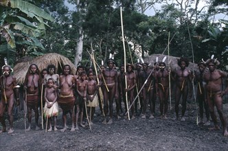 INDONESIA, Irian Jaya, Baliem Valley, Dani villagers preparing for a mock battle.