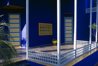 MOROCCO, Marrakesh, The Jardin Majorelle owned by Yves St Laurent.  Corner of balcony with walls