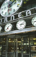 USA, New York, Manhattan, Exterior of Tourneau watch shop with clock displays above the entrance.