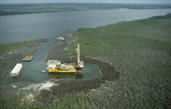NIGERIA, Industry, Aerial view over oil rig in swamp near Bonny.