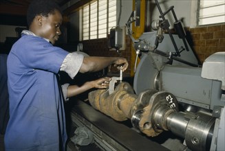 NIGERIA, Industry, Male worker in generator factory.