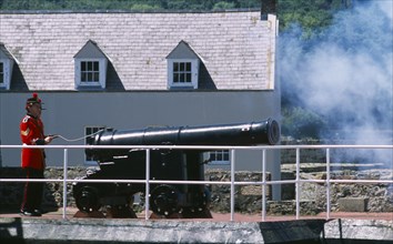 UNITED KINGDOM, Channel Islands, Guernsey, St Peter Port. Castle Cornet. Noon Day Gun being fired.
