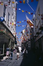 UNITED KINGDOM, Channel Islands, Guernsey, "St Peter Port. View up narrow cobbled high street,