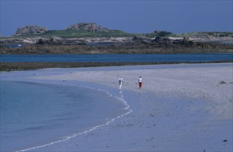UNITED KINGDOM, Channel Islands, Guernsey, Castel. Cobo Bay. View across sandy shoreline with