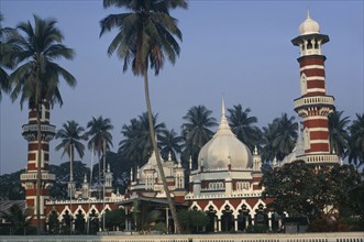 MALAYSIA, Kuala Lumpur, Masjid Jamek or Friday Mosque.  Exterior with domed roof and red and white