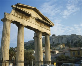 GREECE, Central, Athens, Plaka - Ancient Agora and Acropolis on top. Old ruined columns behind a