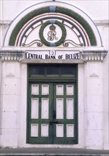 BELIZE, Belize City, The front door of the central bank with a crest in the archway above and