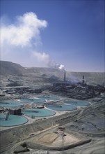 CHILE, Antofagasta, Chuquicamata, Copper Mine with smoke coming out of a stack in the distance.