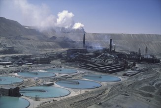 CHILE, Antofagasta, Chuquicamata, Copper Mine with smoke coming out of  stacks in the distance.
