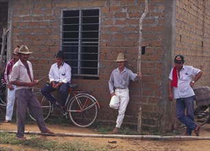 COLOMBIA, Casanare, "A group of Llanero men standing next to a building, Orocue,"