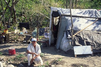 COLOMBIA, Yopal, "Squatter, attracted by oil boom, outside his temporary housing."