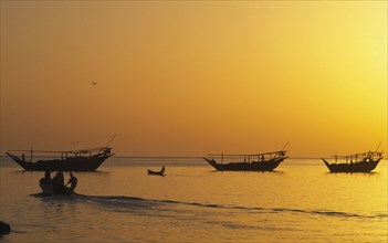 OMAN, Sur, "Traditional Omai fishing Dhows, returning to port, early morning."