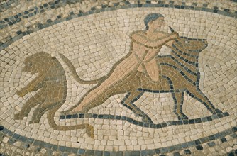 MOROCCO, Volubilis, Detail of mosaic depicting man wrestling bull.