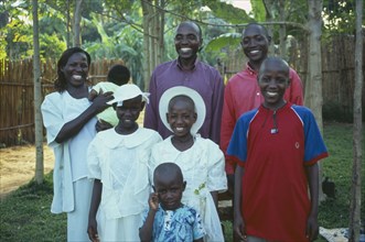 UGANDA, Family, "Husband, wife and six children dressed in Sunday best."