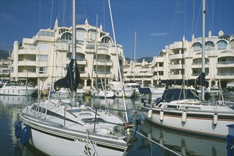 SPAIN, Andalucia, Benalmadena, Award winning marina project in Europe. Boats docked with buildings