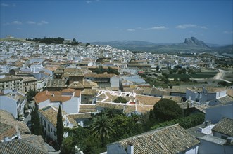 SPAIN, Andalucia, Antequera, View over roofs and streets with Torcal Plateau beyond.
