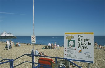 ENGLAND, East Sussex, Eastbourne, Child safety awarness sign Kid Zone displayed next to railings on