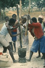 ANGOLA, Work, Village women pounding grain.