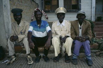 ANGOLA, Malange, Four Malange chiefs seated and wearing different hats.
