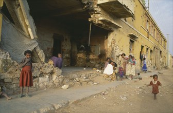 ERITREA, Decamare, Displaced women and children in war damaged building