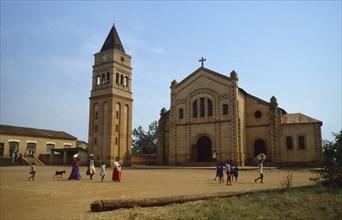 RWANDA, Religion, Missionary church and school with women and children walking across courtyard in