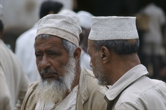 TANZANIA, Zanzibar Island, Zanzibar Town, Two Muslim men.