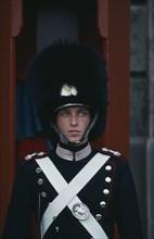 DENMARK, Zealand, Copenhagen, Portrait of guard outside the Amalienborg Palace.