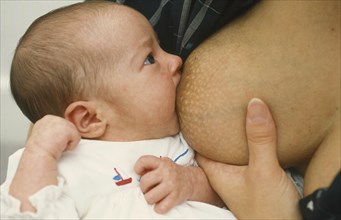 CHILDREN, Babies, Breastfeeding, Four and a half week old baby girl breastfeeding.
