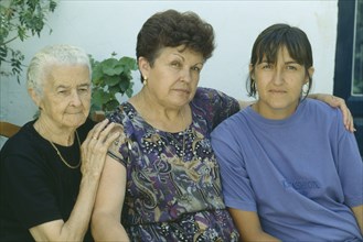 SPAIN, Andalucia, "Portrait of grandmother, daughter and grand-daughter.  Three generations."