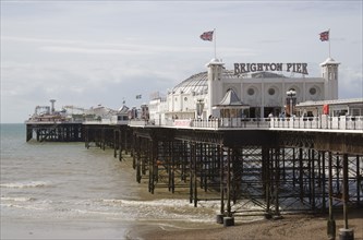 ENGLAND, East Sussex, Brighton, The Brighton Pier at low tide