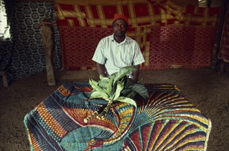 CAMEROON, South West, Rumpi Hills, Leopard Cult elder sitting inside Ekpe house with spiritually