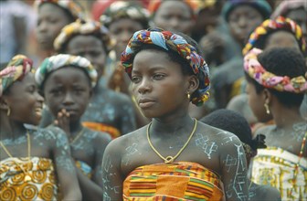 GHANA, Near Accra, Women with painted bodies at an ancestor worship ceremony