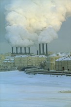 RUSSIA, Moscow, Industrial chimneys emitting thick smoke over Moscow in snow.