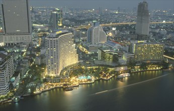 THAILAND, Bangkok, Aerial view of the Skyline. Large Hotel with swimming pool and boats next to the