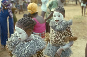 SIERRA LEONE, People, Young girls attending initiation ceremony with white painted faces.