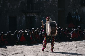 PERU, Music, Masked Taquile drummer performing for Yuyachkani folkloric group.