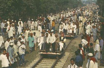 BANGLADESH, Dhaka, Railway inspectors checking and clearing track before train due to huge crowds
