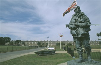 ENGLAND, Hampshire, Portsmouth, Royal Marines Museum. Large statue of a Royal Marine holding gun on