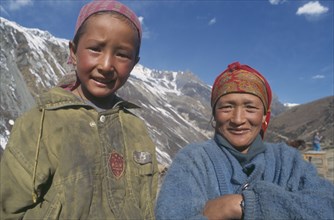 NEPAL, Letdar, Head and shoulders portrait of mother and daughter.