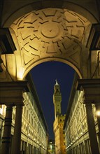 ITALY, Tuscany, Florence, Palazzo Vecchio framed by arch of Loggia Medici and Galleria Uffizi at