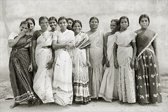 INDIA, Tamil Nadu, Vellamadam, Female workers at St. Joseph's Orphanage smile and laugh for the