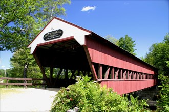 USA, New Hampshire, Conway, "Swift River Covered Bridge, wooden structure over water."