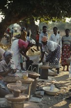 MOZAMBIQUE, Maxixe, Women selling beans and pulses at street market.