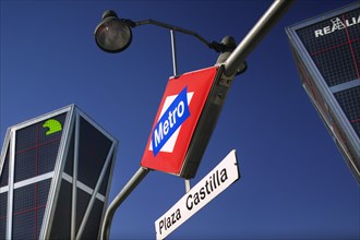 SPAIN, Madrid, "City centre metro sign, Plaza Castilla, beneath the Torres Puerta Europa.